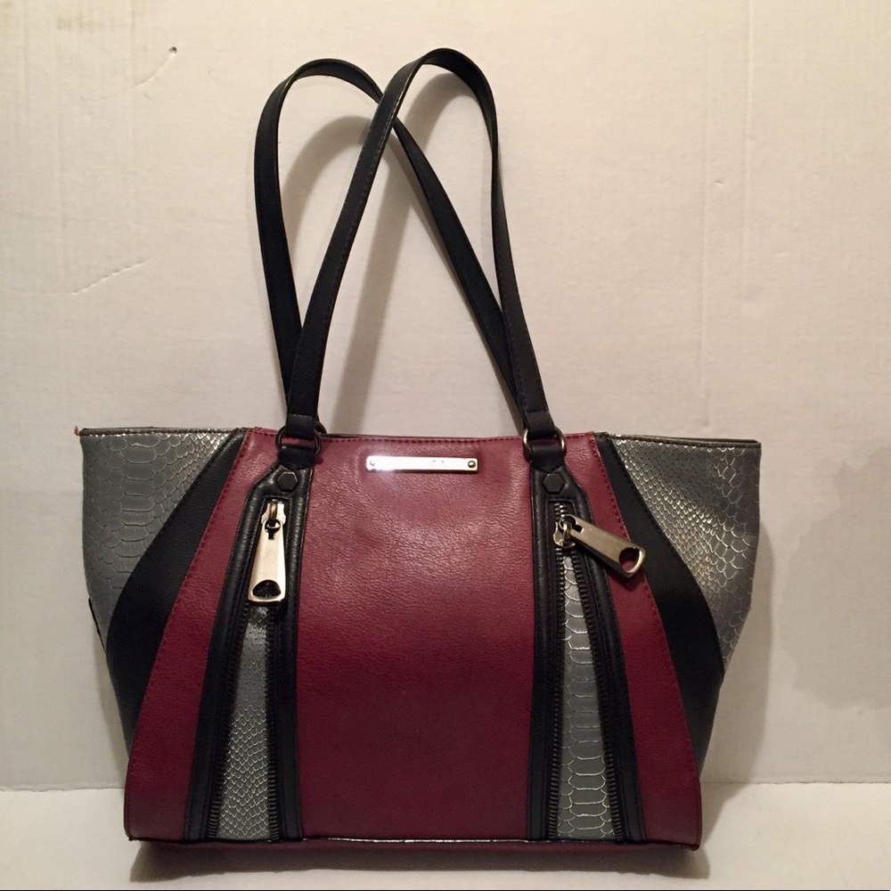 Super cute edgy purse. Gianni Binni